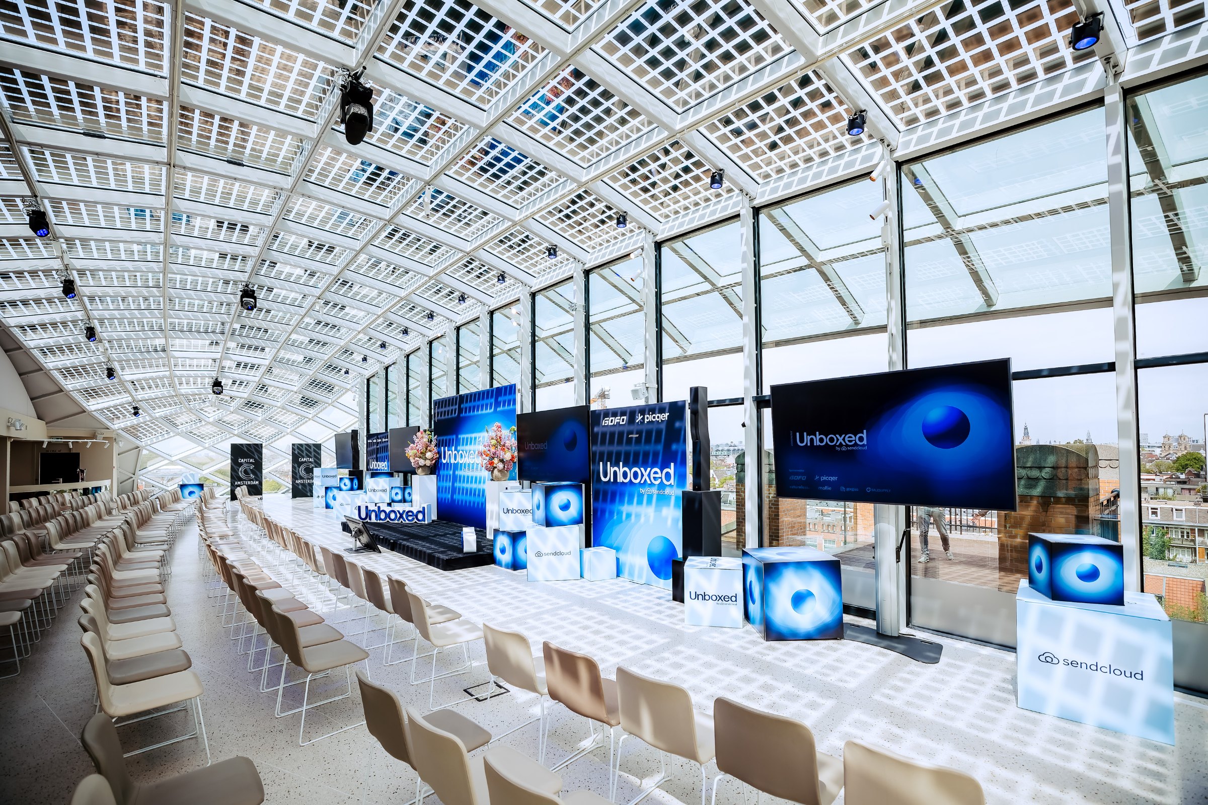 Sendcloud Unboxed 2026 2026: wide shot of the stage and the crowd in Amsterdam