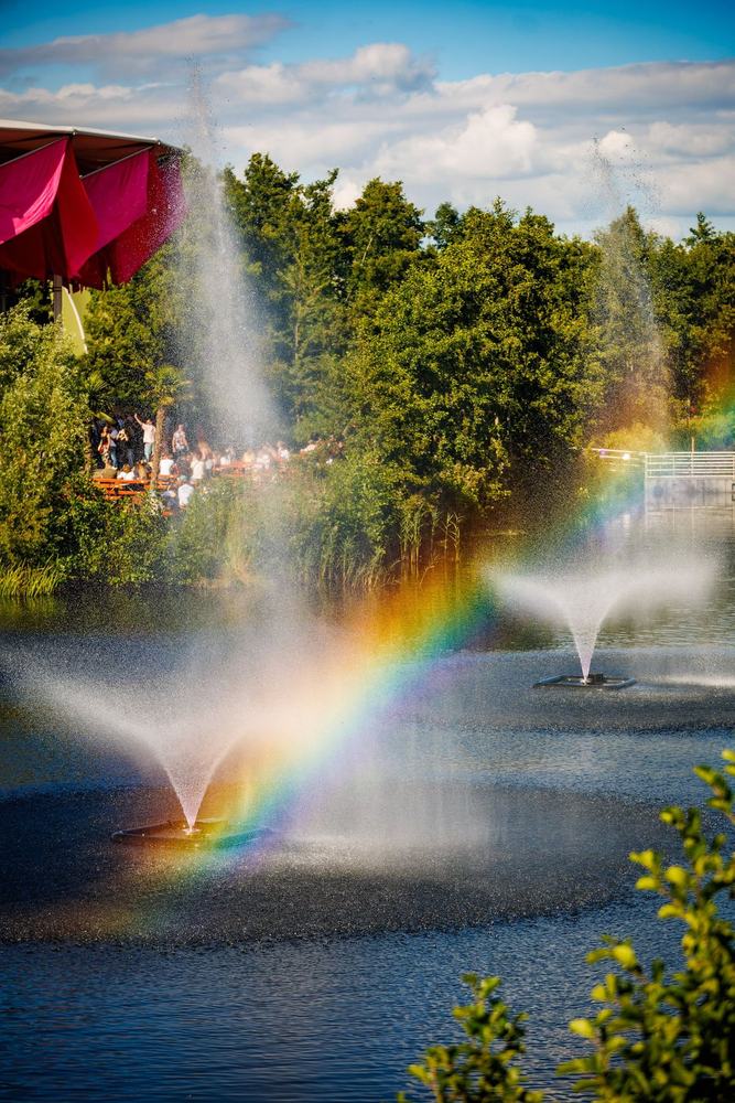 Fountains with a rainbow at the festival grounds