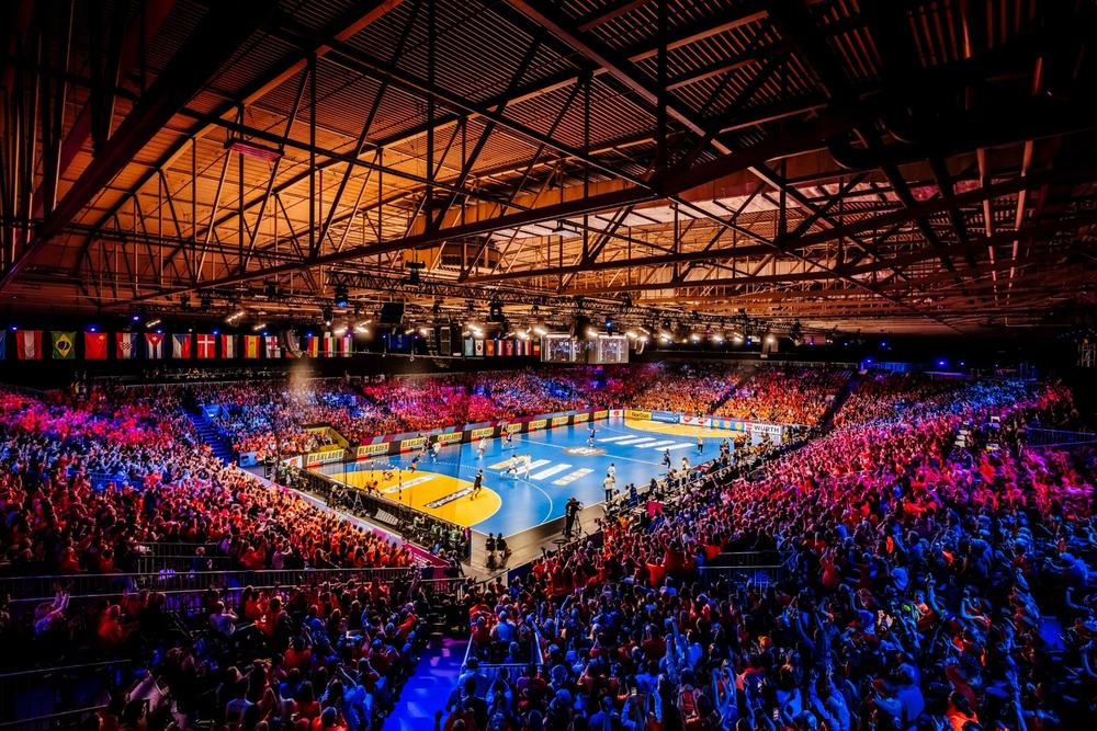 Handball match in a packed arena seen from above